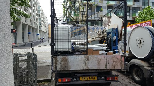 Construction site with waste materials and disposal containers