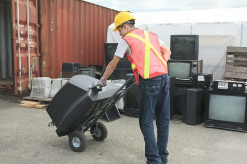 Professionals sorting items during house clearance