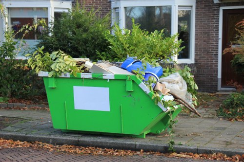 Loading construction debris into grab hire